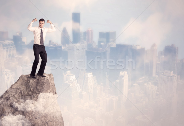 Winner urban businessman on top of stone  Stock photo © ra2studio