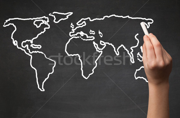 Adult drawing world map on chalkboard Stock photo © ra2studio