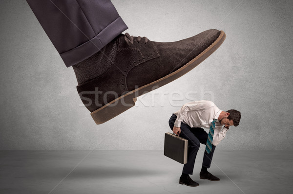 Employee afraid of the big boss foot Stock photo © ra2studio