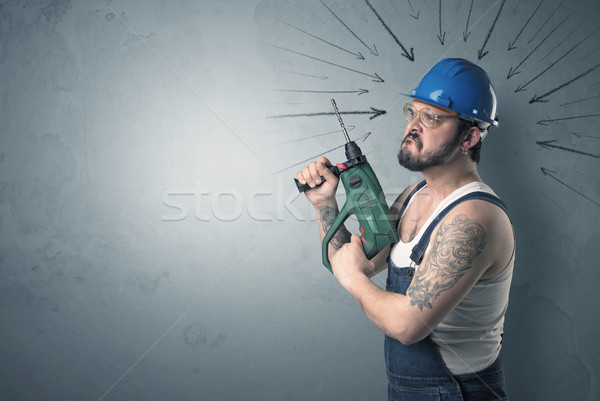 Worker standing with tool. Stock photo © ra2studio