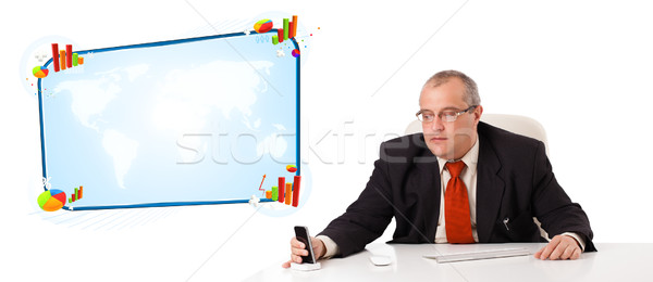 businessman sitting at desk and holding a mobilephone, isolated on white Stock photo © ra2studio
