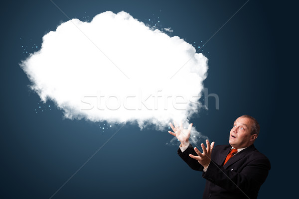 Stock photo: Crazy businessman presenting abstract cloud copy space