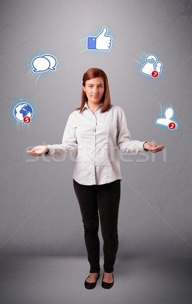 attractive young woman juggling with social network icons Stock photo © ra2studio