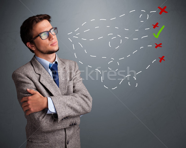 Stock photo: Young man choosing between right and wrong sings