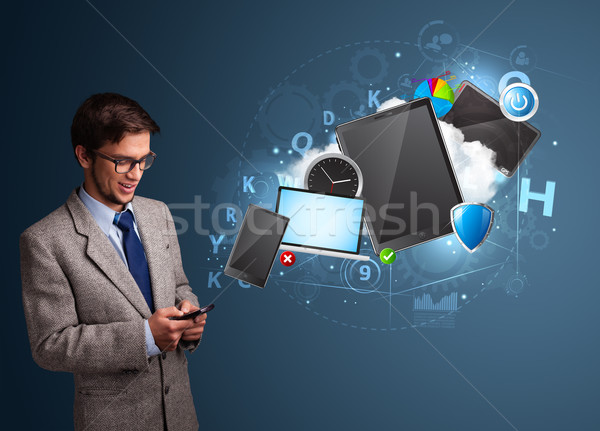 Attractive boy browsing on his smartphone Stock photo © ra2studio