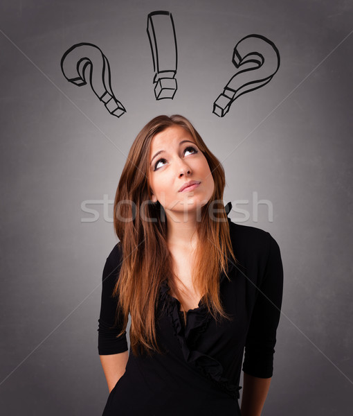 Young lady thinking with question marks overhead Stock photo © ra2studio