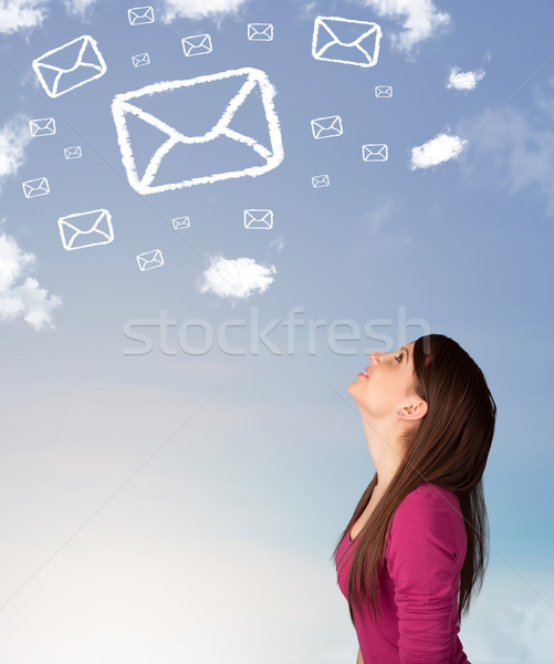 Genç kız bakıyor posta simge bulutlar mavi gökyüzü Stok fotoğraf © ra2studio