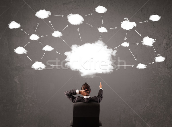 Biznesmen posiedzenia Chmura technologii powyżej głowie Zdjęcia stock © ra2studio