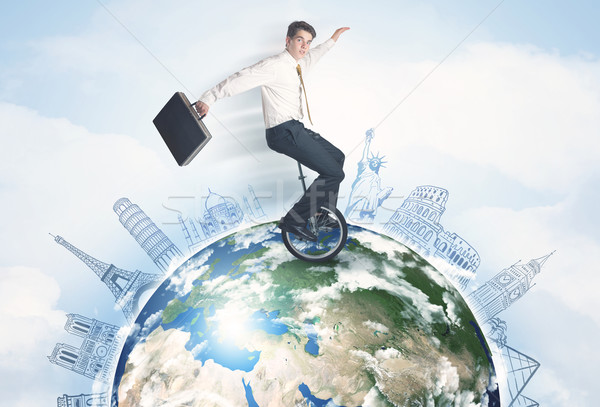 человека верховая езда одноколесном велосипеде вокруг мира Сток-фото © ra2studio