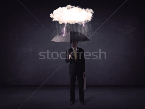 бизнесмен Постоянный зонтик мало Storm облаке Сток-фото © ra2studio
