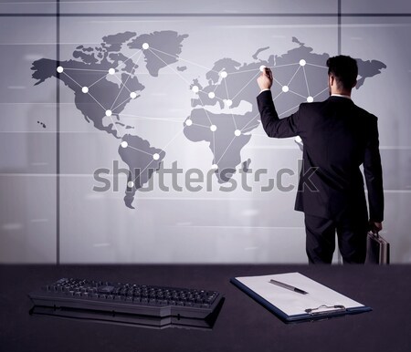 Business person drawing dots on world map Stock photo © ra2studio