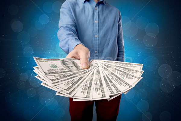 Zakenman geld jonge groot bedrag Stockfoto © ra2studio