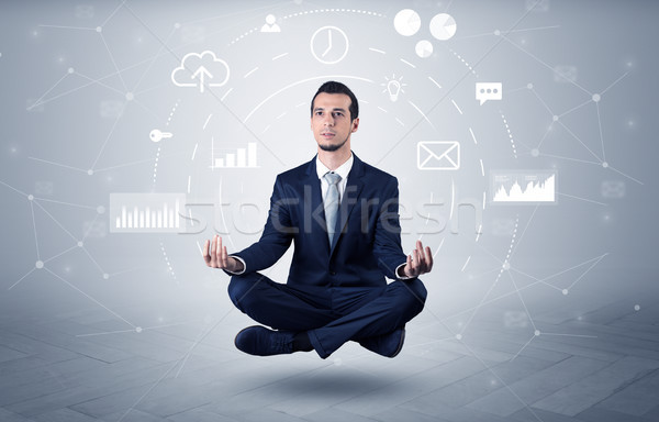 Businessman levitates with data circulation concept Stock photo © ra2studio