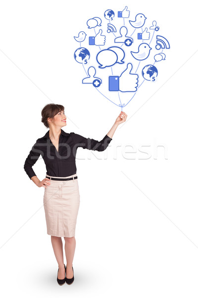 Stock photo: Happy lady holding social icon balloon