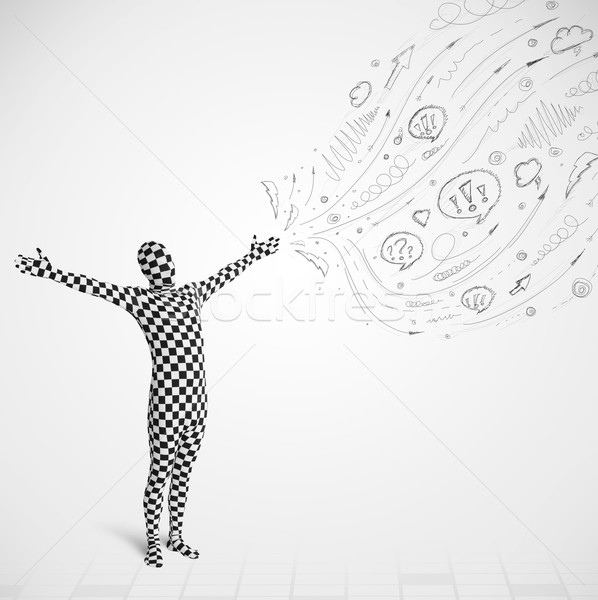 Guy in body suit morphsuit looking at sketches and doodles Stock photo © ra2studio