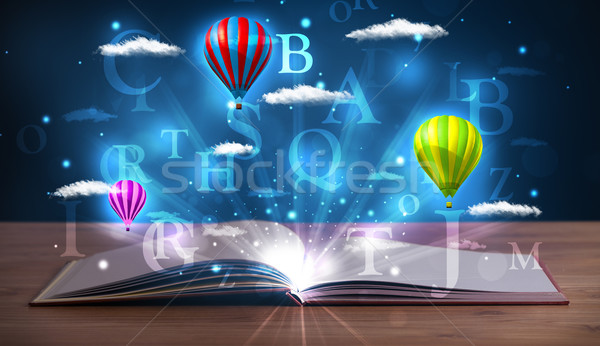 Open book with glowing fantasy abstract clouds and balloons Stock photo © ra2studio