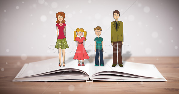 Drawing of a happy family on opened book Stock photo © ra2studio