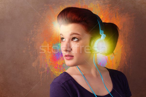 Young woman with headphones listening to music Stock photo © ra2studio