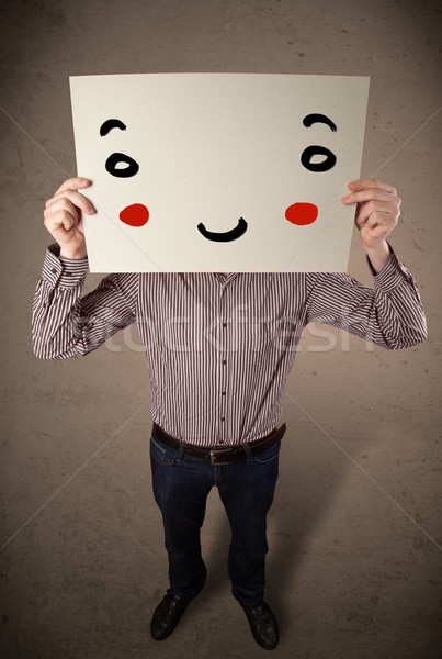 Empresário cartão rosto sorridente jovem mão Foto stock © ra2studio