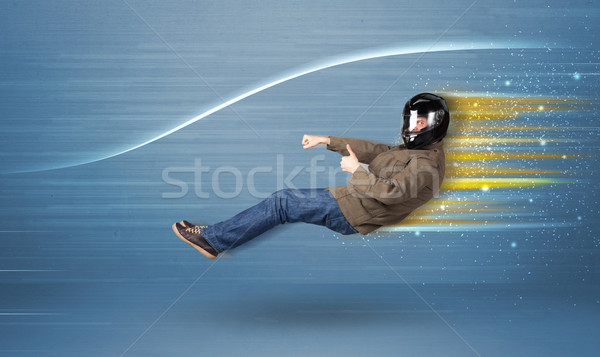 Young man driving in imaginary fast car with blurred lines  Stock photo © ra2studio