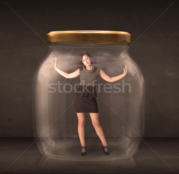Businesswoman captured in a glass jar concept Stock photo © ra2studio
