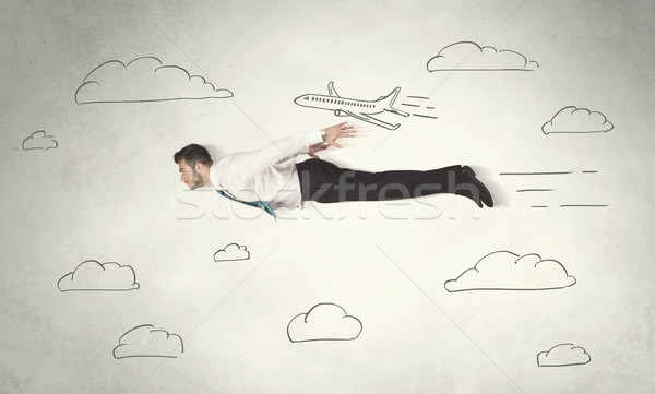 Cheerful business person flying between hand drawn sky clouds Stock photo © ra2studio