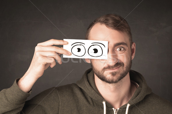 Funny man looking with hand drawn paper eyes Stock photo © ra2studio