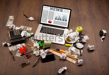 Laptop on office desk with business website on screen Stock photo © ra2studio