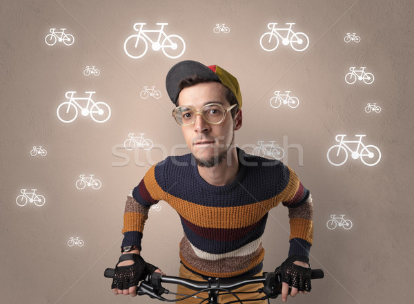 Lunatic cyclist with bike on the background Stock photo © ra2studio