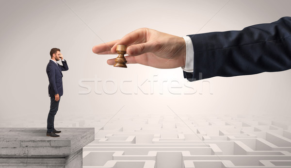 Little businessman from the top of the labyrinth thinking about strategies Stock photo © ra2studio