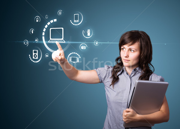 Stock photo: Businesswoman pressing virtual media type of buttons