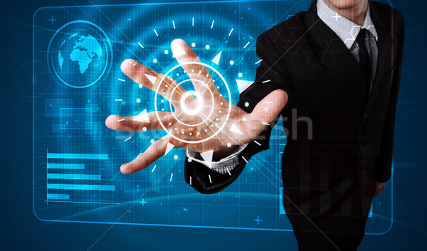 Businessman pressing high tech type of modern buttons Stock photo © ra2studio
