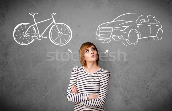 Woman making a choice between bicycle and car Stock photo © ra2studio