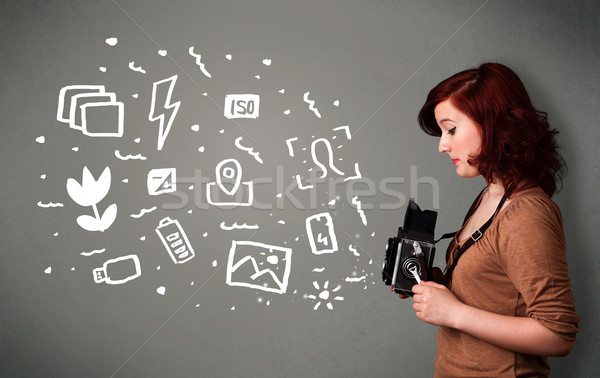 Photographer girl capturing white photography icons and symbols Stock photo © ra2studio