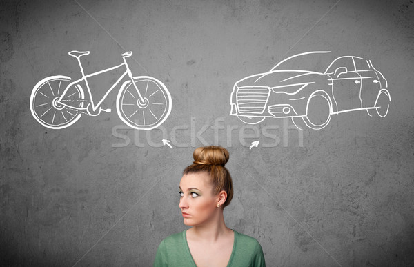 Woman making a choice between bicycle and car Stock photo © ra2studio