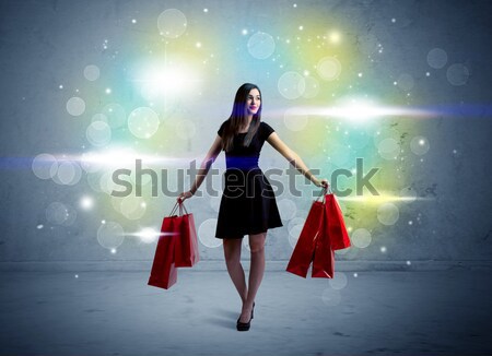 Mall lady with shopping bags and glitter light Stock photo © ra2studio