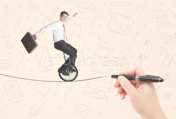 Businessman riding monocycle on a rope drawn by hand Stock photo © ra2studio