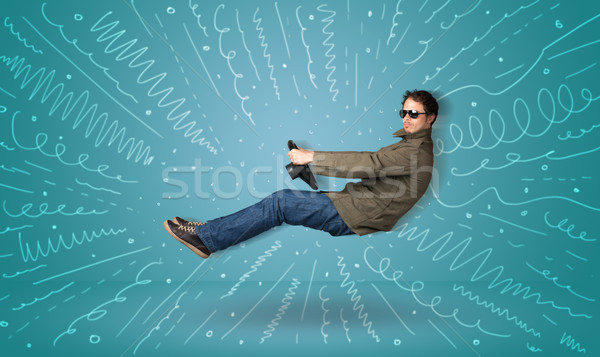 Funny guy drives an imaginary vehicle with drawn lines around hi Stock photo © ra2studio