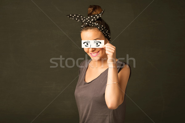 Silly youngster looking with hand drawn eye paper Stock photo © ra2studio