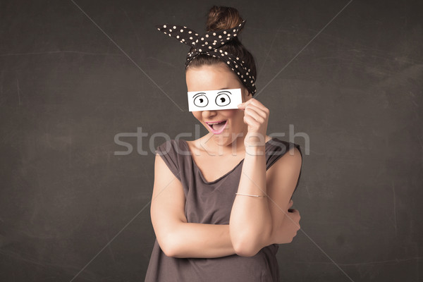 Funny woman looking with hand drawn paper eyes Stock photo © ra2studio