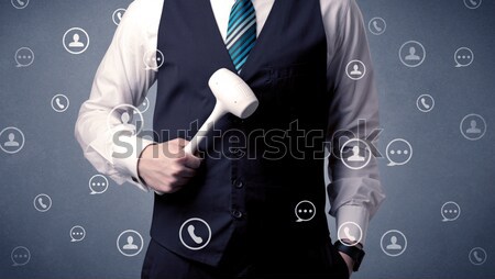 Man in suit wearing smartwatch. Stock photo © ra2studio