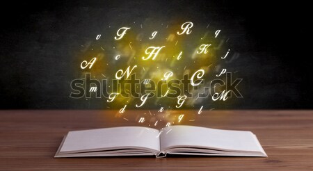 Alphabet letters over book  Stock photo © ra2studio