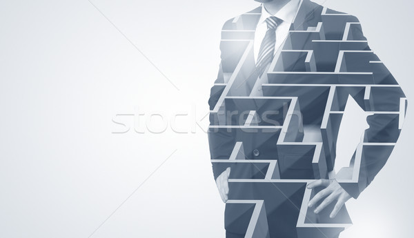 Businessman standing and thinking  with maze Stock photo © ra2studio