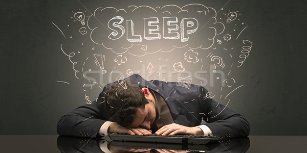 Businessman fell asleep at his workplace with ideas, sleep and tired concept Stock photo © ra2studio