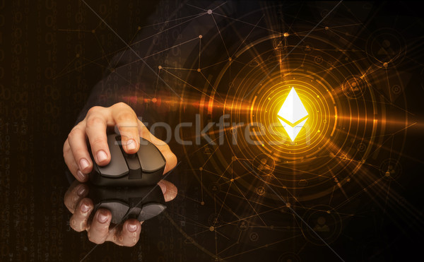 Hand using mouse with cryptocurrency concept Stock photo © ra2studio