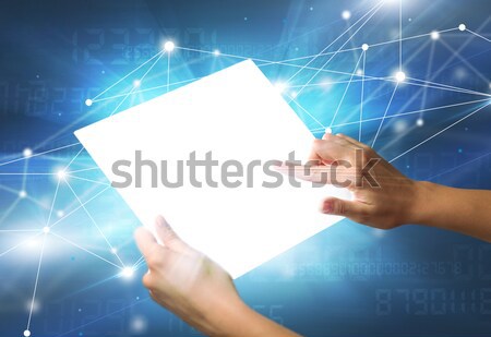 Hands touching a glass-like tablet  Stock photo © ra2studio