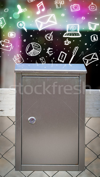 Colorful icons and symbols bursting out of a mailbox Stock photo © ra2studio