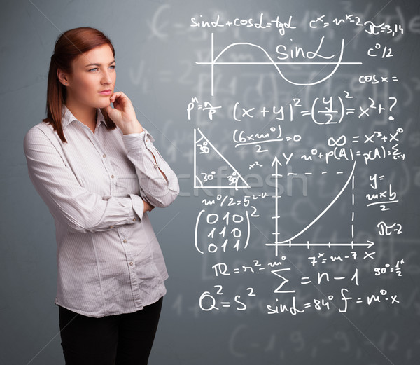 Beautiful school girl thinking about complex mathematical signs Stock photo © ra2studio