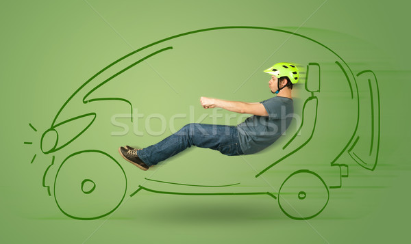 Man drives an eco friendy electric hand drawn car  Stock photo © ra2studio