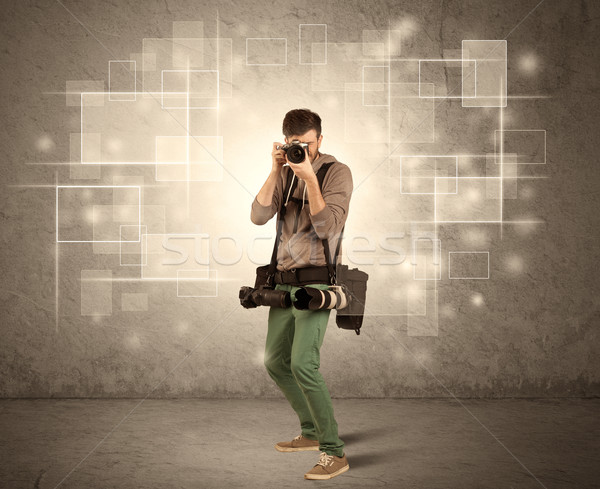 Male holdig professional camera with lens Stock photo © ra2studio